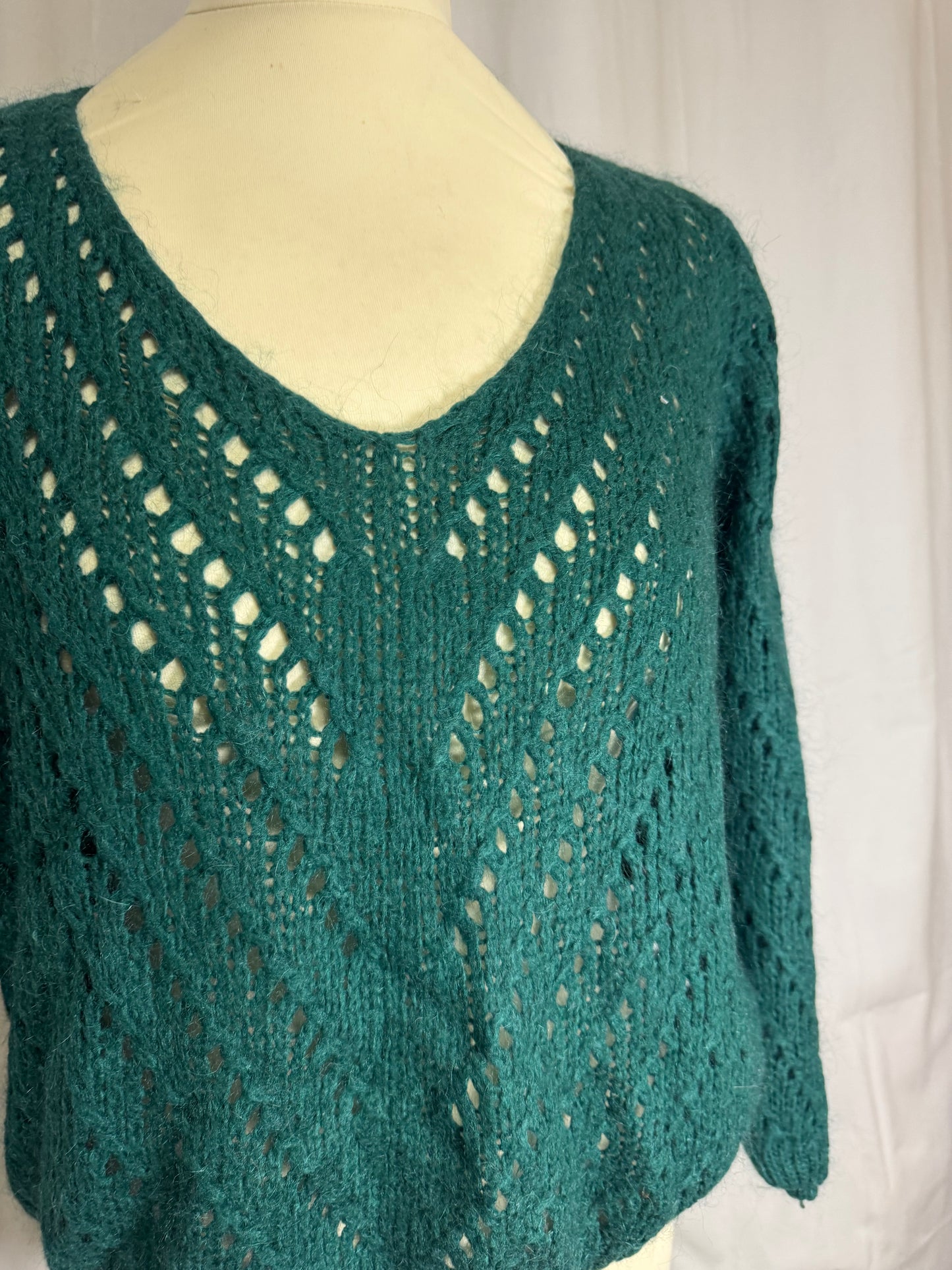 Pull vert ajourée