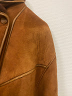 Manteau en peau lainée mi long