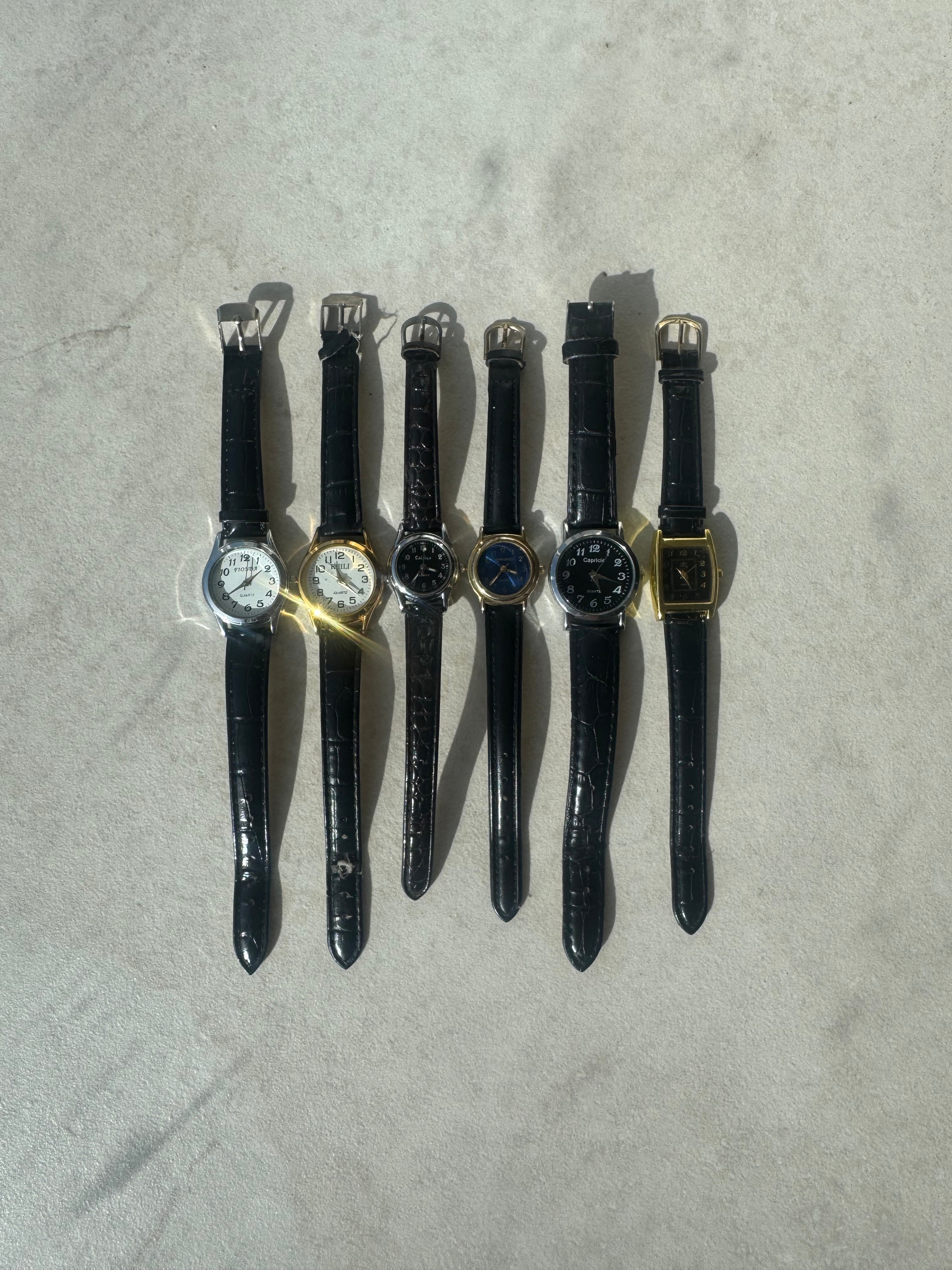 Montres en cuir noires