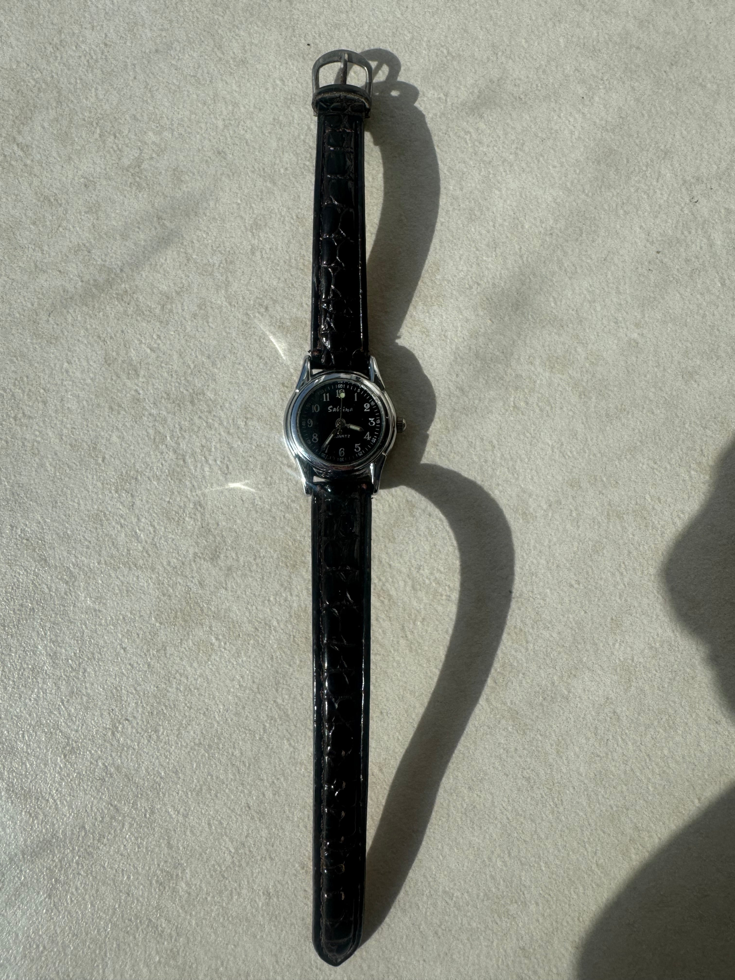 Montres en cuir noires