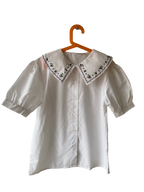 Chemise à grand col